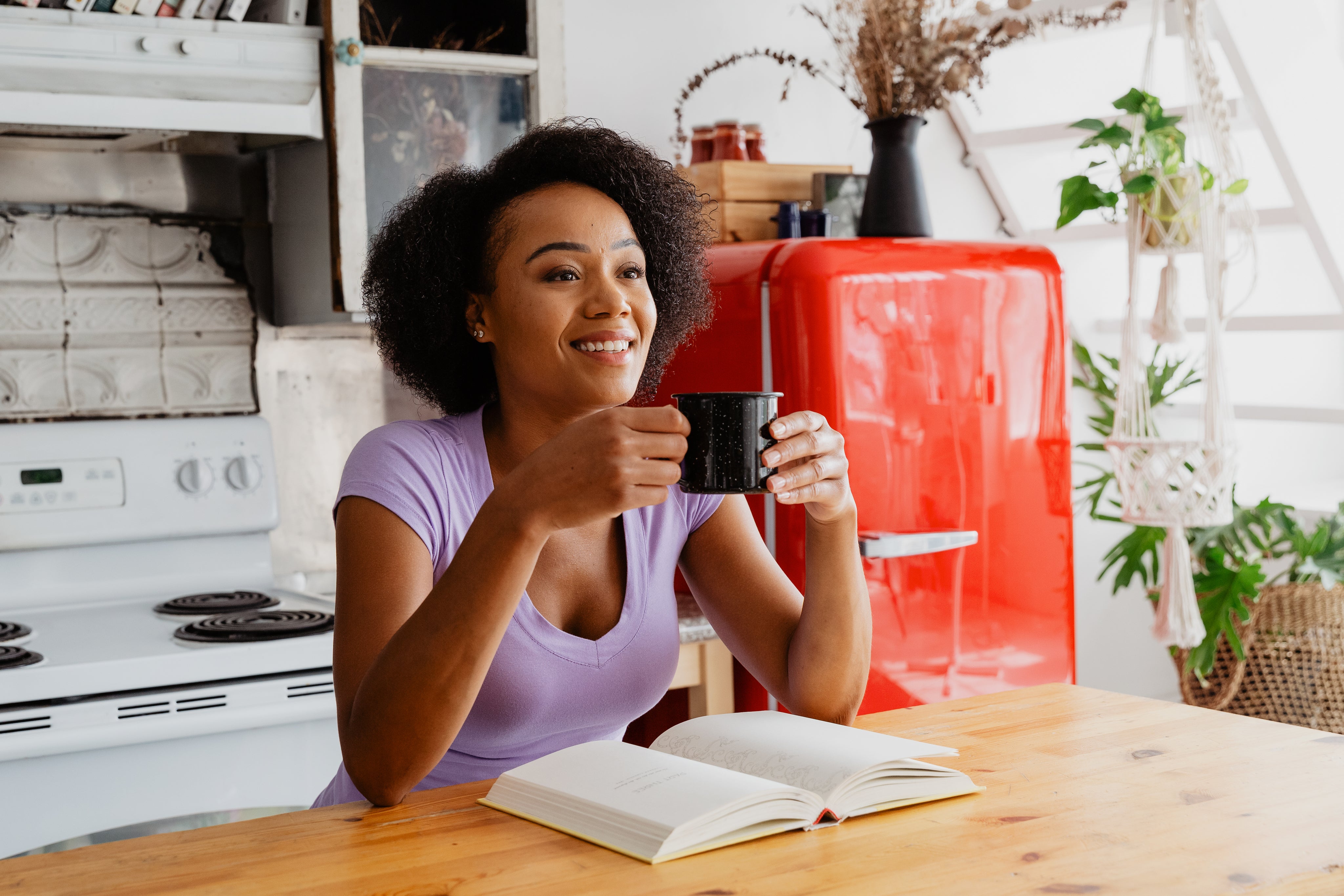 files/woman-enjoying-coffee-and-book-in-the-kitchen.jpg